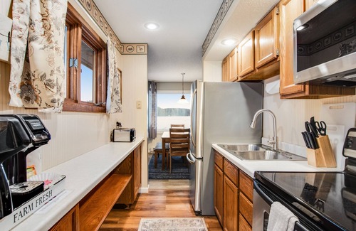 Three Lakes Cabin | Gorgeous water views, deck, private boat slip, indoor pool, hot tubs, & gym