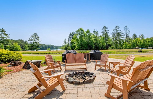 Three Lakes Cabin | Gorgeous water views, deck, private boat slip, indoor pool, hot tubs, & gym