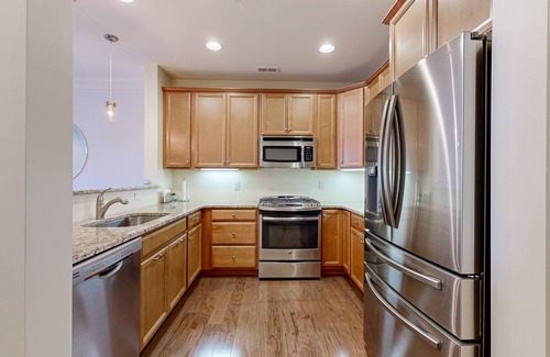 Rehoboth Beach Condo | Grande at Canal Pointe 1st floor condo w/shared pool, tennis court & gym