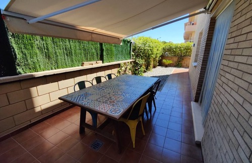 Els Griells Apartment | Ground floor with large terrace next to the beach