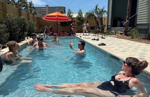 Biloxi House | Group travel & family vacation home destination with a pool, balcony and cabana.