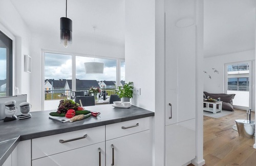 Olpenitz Apartment | "Hamptons" Baltic Sea vacation with a 3-minute walk to the beach, fireplace and water view