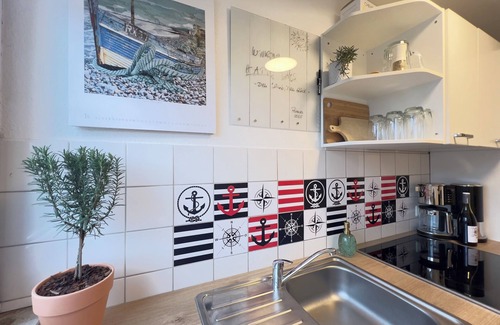 Petersdorf Apartment | HAPPY DAYS Fehmarn -Your vacation & your happiness- 91 sqm balcony with field view and fireplace