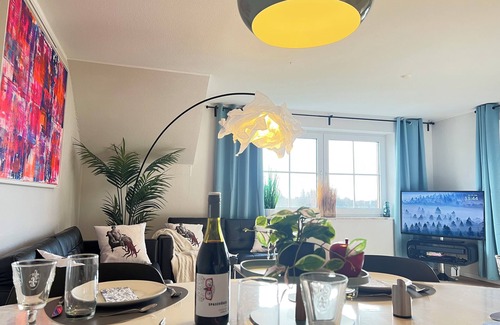 Petersdorf Apartment | HAPPY DAYS Fehmarn -Your vacation & your happiness- 91 sqm balcony with field view and fireplace