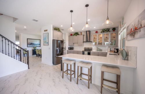 Melbourne Beach House | Harbor Island beach house with private and public pools.