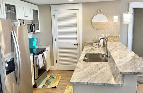 Villa Lago Condo | Heart of Village of Baytowne Wharf with views of Marina, Fireworks and Concerts!