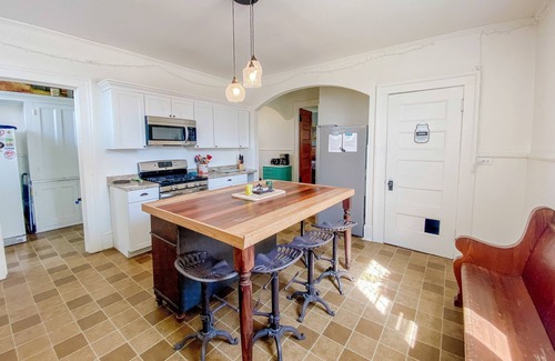Manistee House | Historical dog-friendly home with fenced yard, grill, Ping-Pong, fireplace, & AC