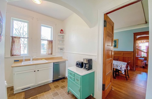 Manistee House | Historical dog-friendly home with fenced yard, grill, Ping-Pong, fireplace, & AC