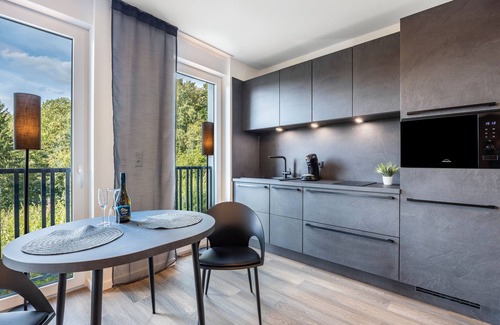 Altenbeken Apartment | Holiday Apartment "Egge Resort 7d" with Balcony, Whirlpool and Sauna with Viaduct View