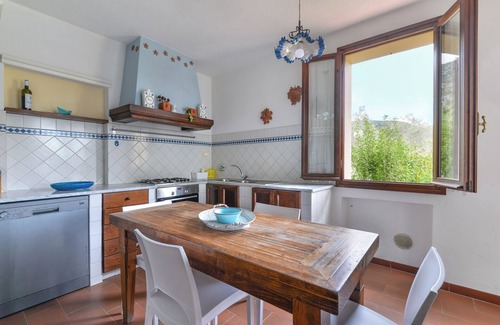 Lacona House | Holiday Home 'Bilocale Mimosa A Lacona' with Shared Pool, Private Garden and Wi-Fi
