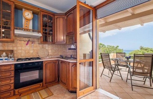 Centro Commerciale House | Holiday Home 'Casa In Residence Villa Marina' with Sea View, Shared Pool and Private Terrace