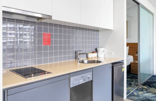 Cairns Central Business District Apartment | Horizons at Harbour Lights Tropical Poolside Flair