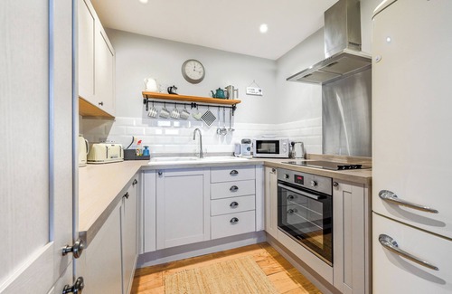 Mabe Cottage | Hot tub and covered seating area with log burner and BBQ