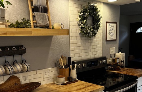 Webster City House | Hot Tub, Fire Pit on patio, Huge Cedar deck with outdoor TV, Fenced in back yard