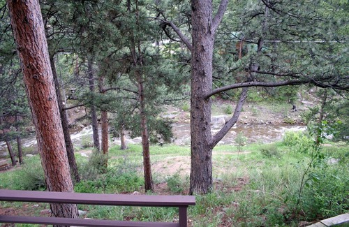 Estes Park Condo | Hot tub suite with full kitchen, patio with river view