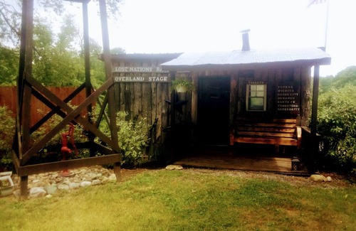 Frontier Cabin | Hunting Cabin Rustic Handcrafted primitive sits in our unique rustic Cowboy Town