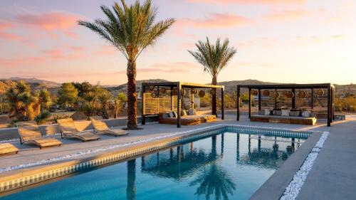 Joshua Tree House | Iconic 6BR Desert Retreat w Pool Pickleball Fire Pit Joshua Tree Masion by AvantStay