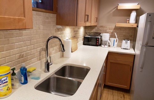 Southwest Calgary Apartment | Ideal furnished 550 sq. ft legal conforming basement suite with bright interior.