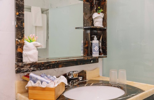 Oura Hotel | Indulge in Home-Like Comfort! Three Relaxing Suites, Pool, Beachfront Property!