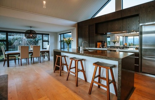Wanaka House | Infinity Drive · Modern, luxury home with a hot tub and lake views.