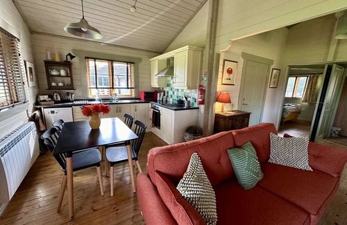 Ampney Crucis House | Iris Lodge with wood burner on Lake Pochard
