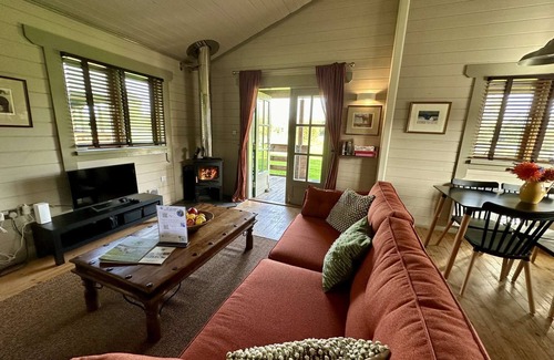 Ampney Crucis House | Iris Lodge with wood burner on Lake Pochard