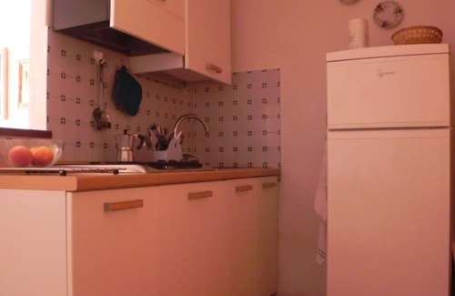 Cala Piccola Apartment | Relax and sea: one room with patio and pool