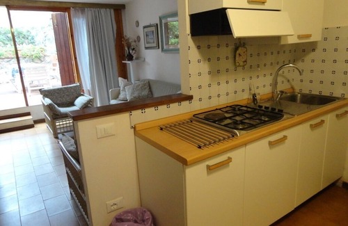 Cala Piccola Apartment | Relax and sea: one room with patio and pool