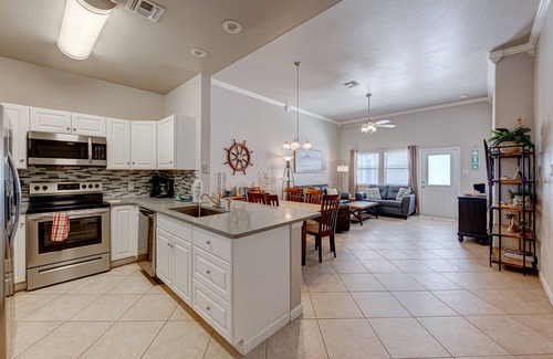 Safe Harbor Condo | Just a few blocks from the beach with a community pool. Sleeps 8!