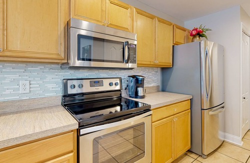 Keys Of Marsh Harbor House | Keys of March Harbor home with on-site pool, tennis, private patio & sunroom