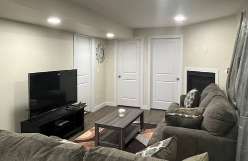 Saskatoon Apartment | Kick back & relax in this calm, stylish space.