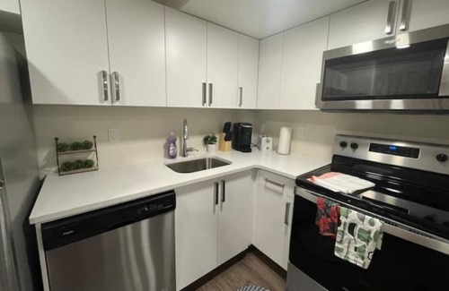 Saskatoon Apartment | Kick back & relax in this calm, stylish space.