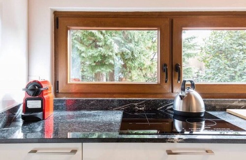 Gonte Apartment | Lake Apartment With Lush Garden Veranda