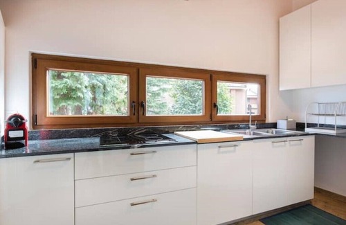 Gonte Apartment | Lake Apartment With Lush Garden Veranda