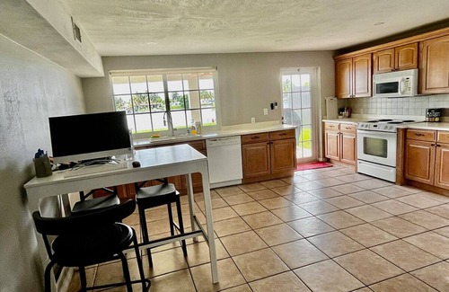 Miami Gardens House | Lake front 3 bed house with sunset views and hot tub, ski in your own back yard
