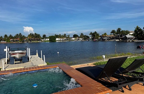 Miami Gardens House | Lake front 3 bed house with sunset views and hot tub, ski in your own back yard