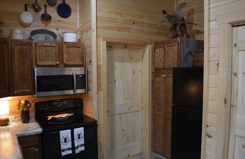 Jones Mills Cabin | Lake toys and hot tub included!