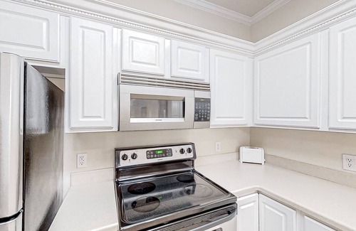 Little River Condo | Lake-view ground-floor condo with screened patio, W/D, & pool