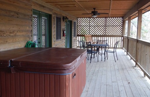 Mount Ida Cottage | Lake view three bedroom, three bath cottage with private hot tub overlooking Lake Ouachita. by RedAwning