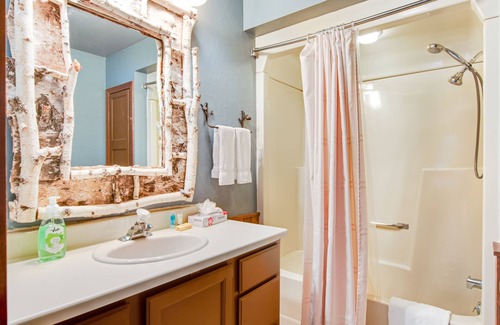 Three Lakes Cabin | Lakefront cabin with lake views, wood stove, hot tubs, heated pool, gym, golf