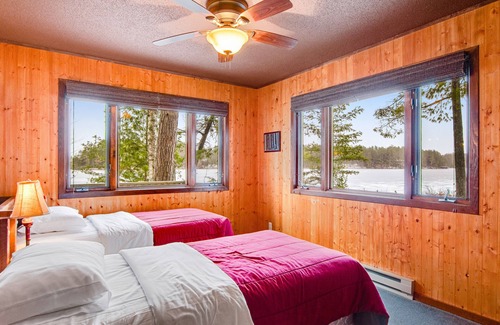 Three Lakes Cabin | Lakefront cabin with lake views, wood stove, hot tubs, heated pool, gym, golf