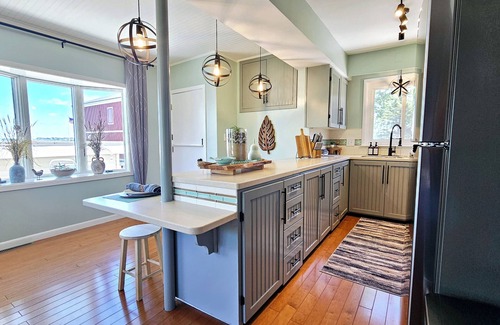 Bluffton House | Lakefront cottage on Muskegon Lake! Fire pit, 40' BOAT DOCK, near beach, shops