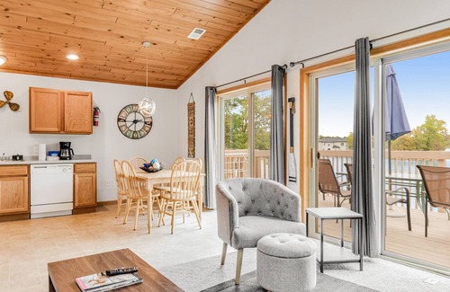 Lake Delton Condo | Lakefront dog-friendly condo near skiing with private beach access, views & dock