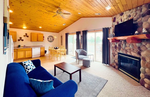 Lake Delton Condo | Lakefront dog-friendly condo near skiing with private beach access, views & dock