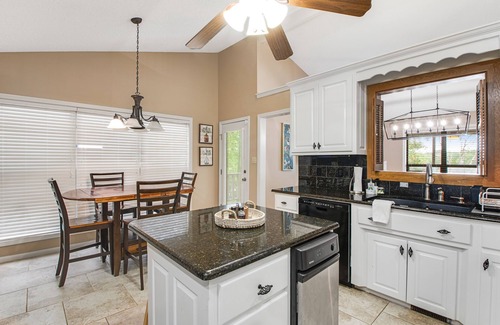 Mid America House | Lakefront dog-friendly home with lake views, dock, firepit, & grill area by lake