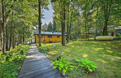 Curtis Township Cottage | Lakefront Hideaway w/Dock, Kayaks, Fire Pit!