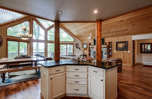Eagle River House | Lakefront home with private dock, beach, firepit, playground, deck & game room
