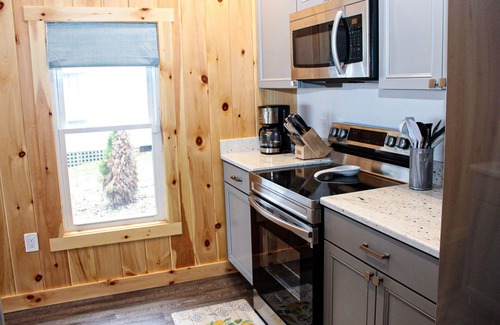 Laconia Cottage | Lakefront home with a deck, gas grill, WiFi, dock & golf nearby