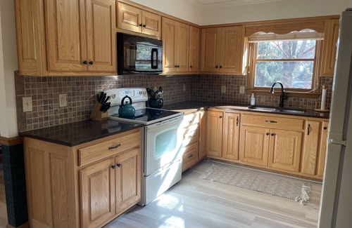 Winchester House | Lakefront home with dock. Cozy 2 bed 2 bath and screened in porch.