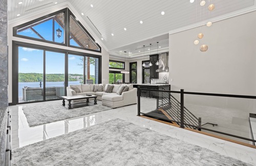 Sunrise Beach House | Lakefront Luxury 7 bed Home with Private Dock, Swim Spa on 13MM in Porto Cima